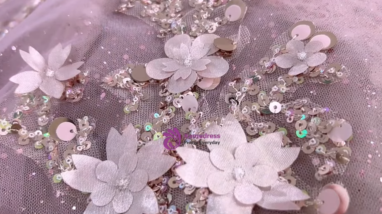 preparing glitter tulle layers for hand beaded pink ball gown
