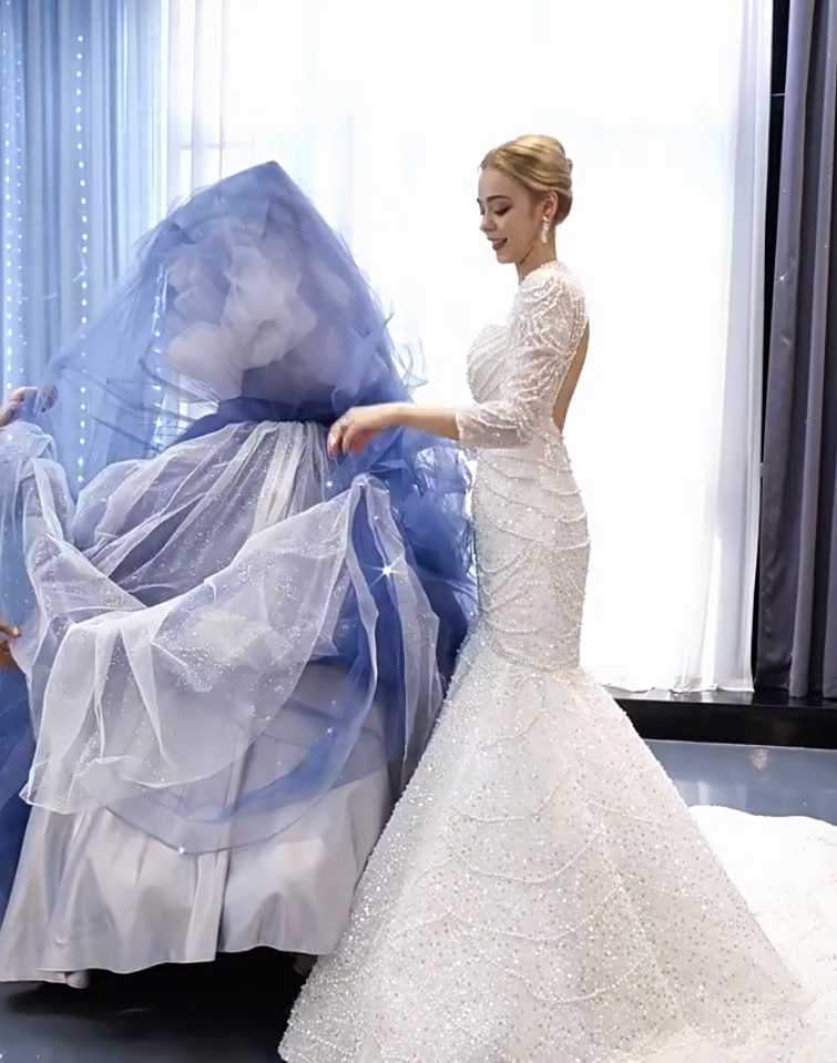 Custom convertible formal gown design featuring a white beaded mermaid dress and layered blue tulle overskirt train Custom convertible formal gown design featuring a white beaded mermaid dress and layered blue tulle overskirt train